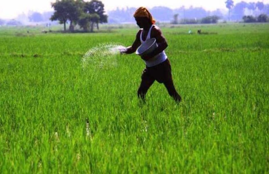 farmer applying fertiliser
