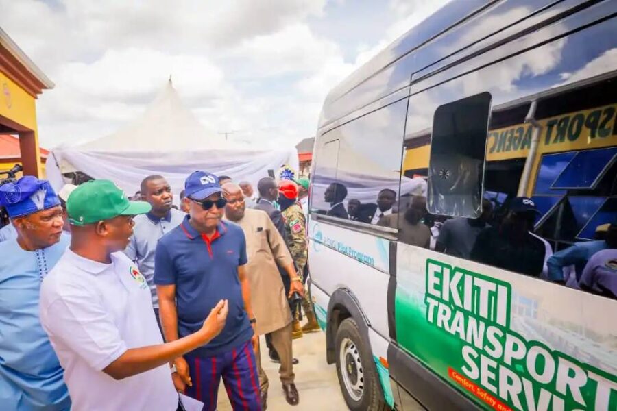 Officials gathered around a new Ekiti Transport Service vehicle.