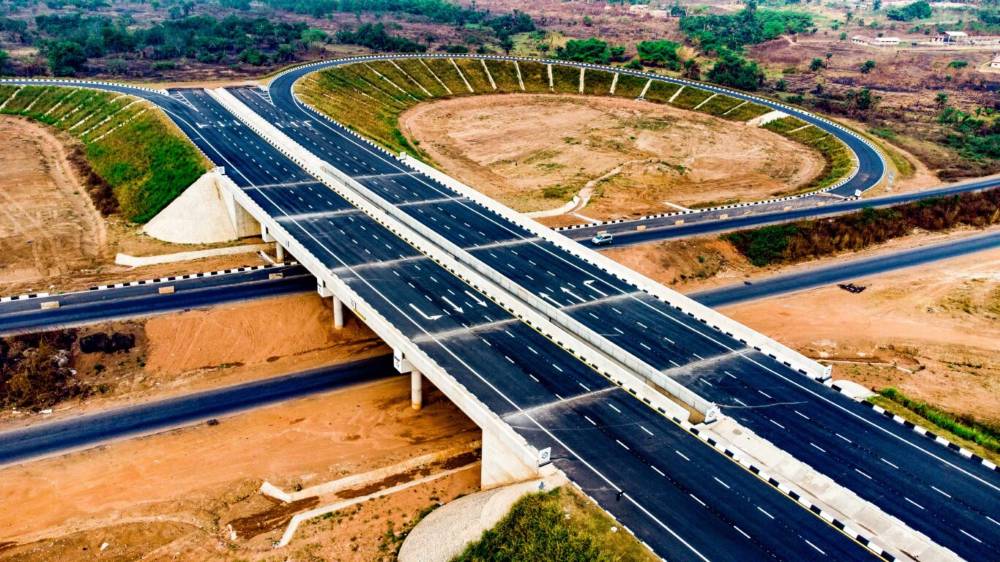 Aerial view of a modern multi-lane highway interchange bridge.