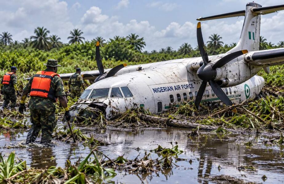 Crashed Nigerian Air Force plane in a swampy area.
