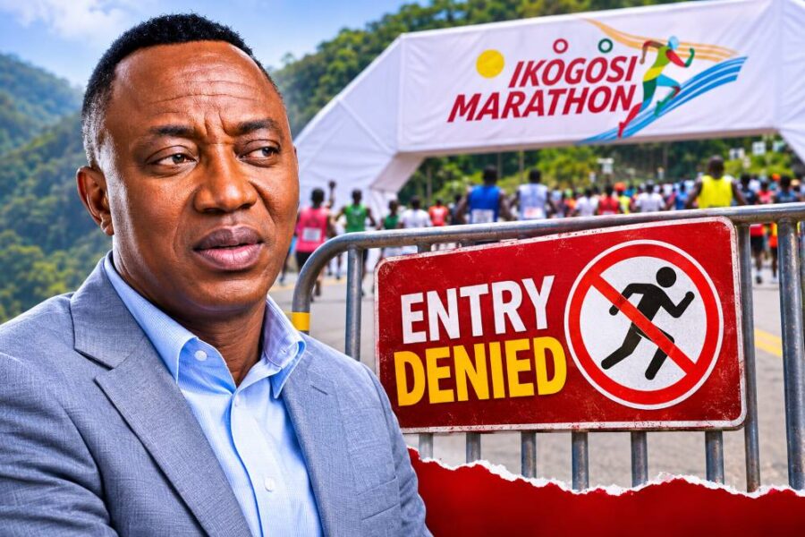 Man in a suit next to an entry denied sign.